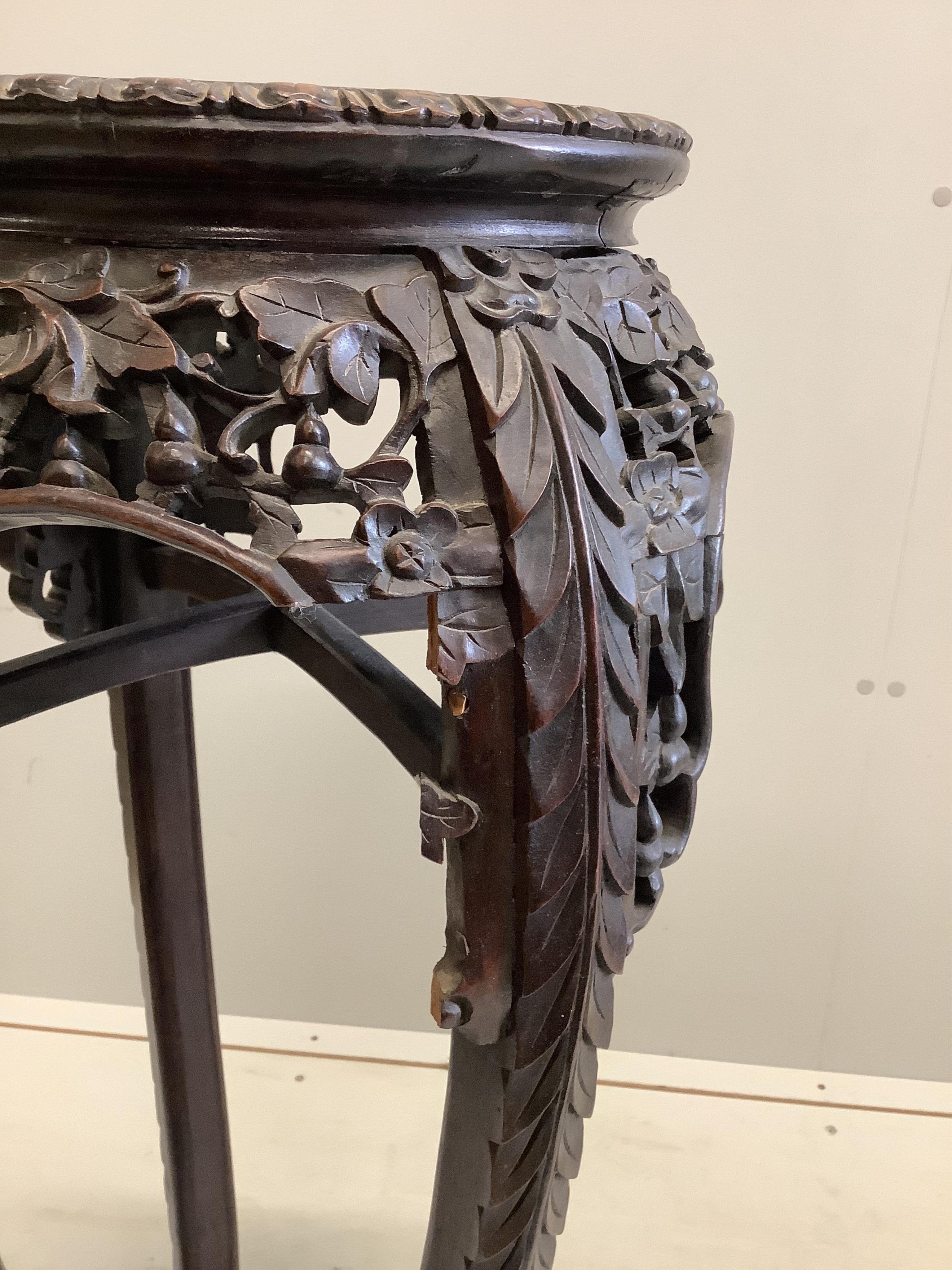 A Chinese hongmu and marble jardiniere stand, height 90cm. Condition - poor